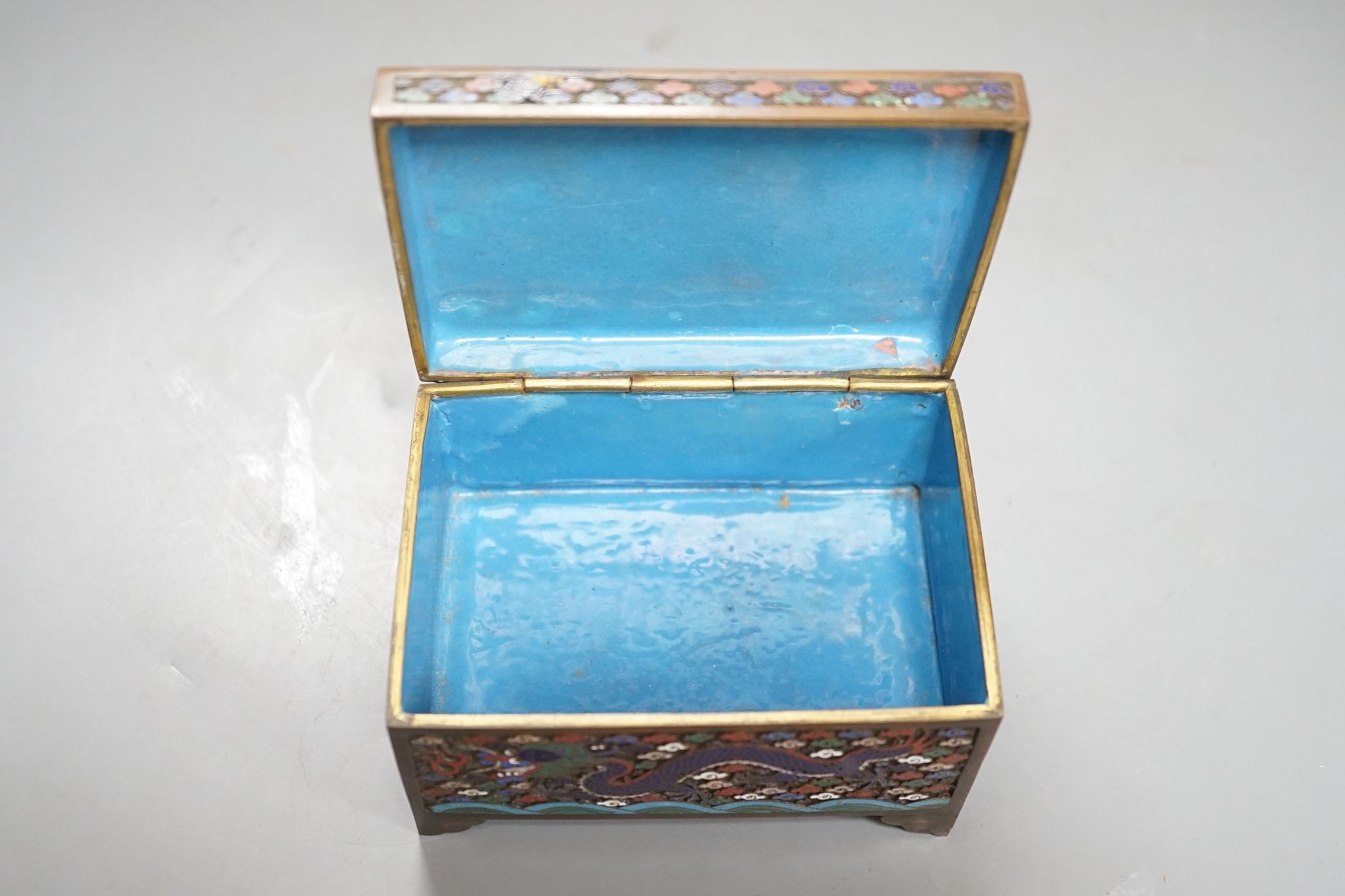 A Chinese bronze and cloisonné enamel ‘dragon’ box and cover, early 20th century, 6 cms high x 11.5 cms wide.